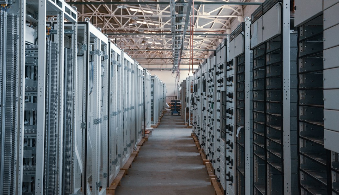 Rows of servers inside a data center representing the infrastructure powering artificial intelligence